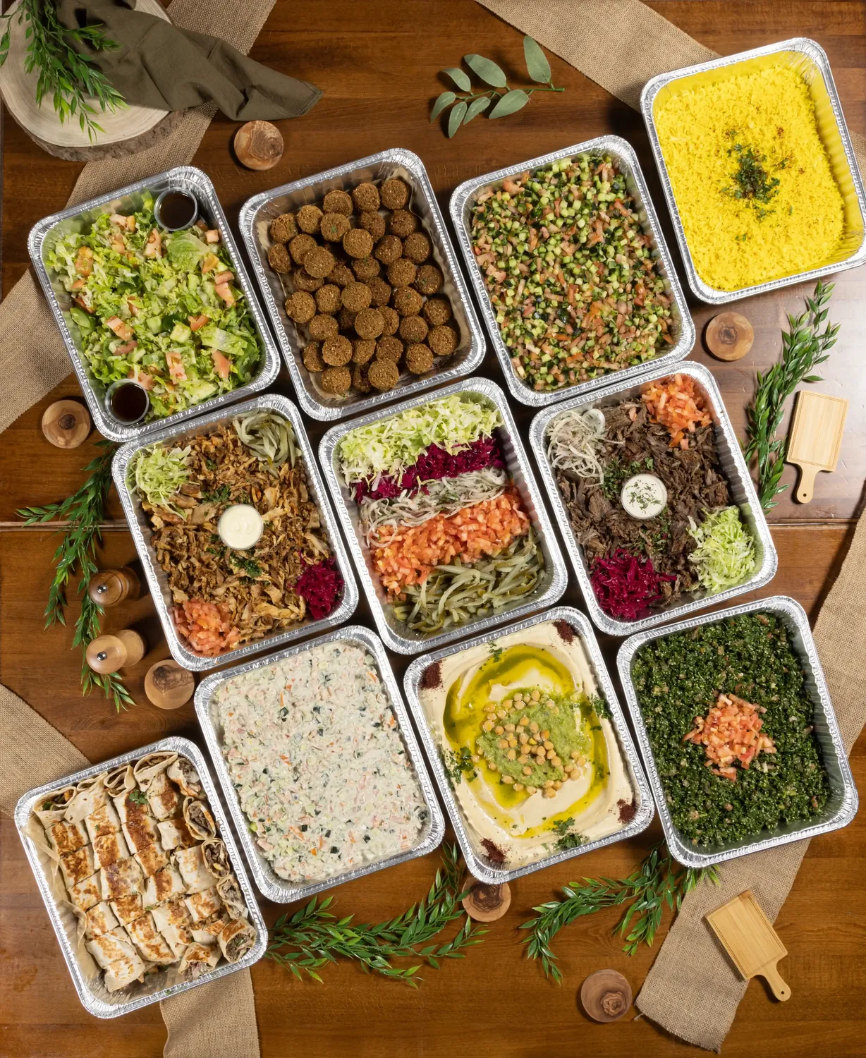 Overhead photograph of SemSem catering dishes and salads