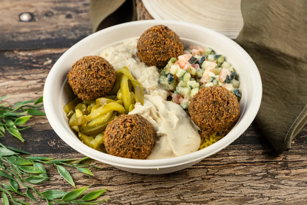 Mediterranean bowl topped with falafel and hummus