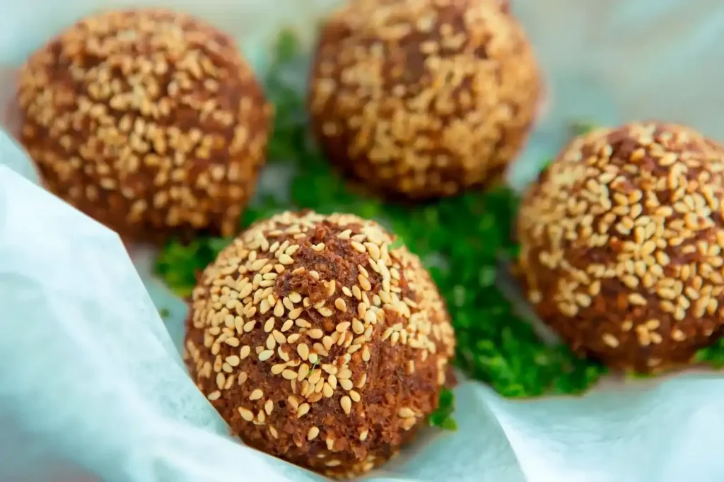 Close-up of falafel covered with sesame seeds